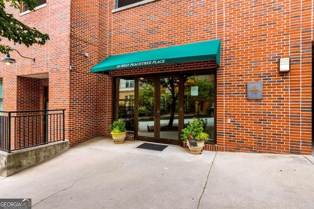 entrance to property featuring french doors