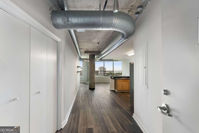 hall with dark hardwood / wood-style floors and sink