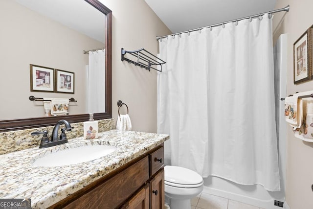 full bathroom with tile patterned flooring, shower / bath combination with curtain, vanity, and toilet