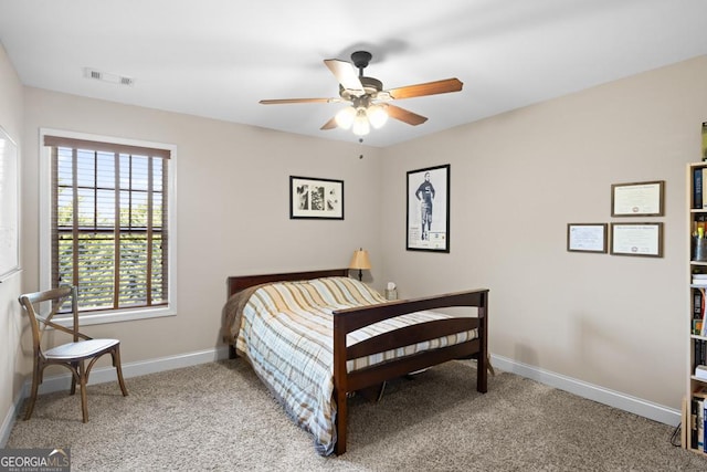 bedroom featuring ceiling fan and light carpet