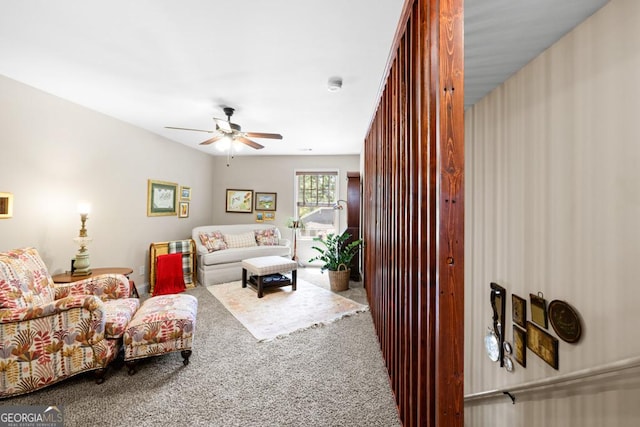 living room featuring carpet and ceiling fan