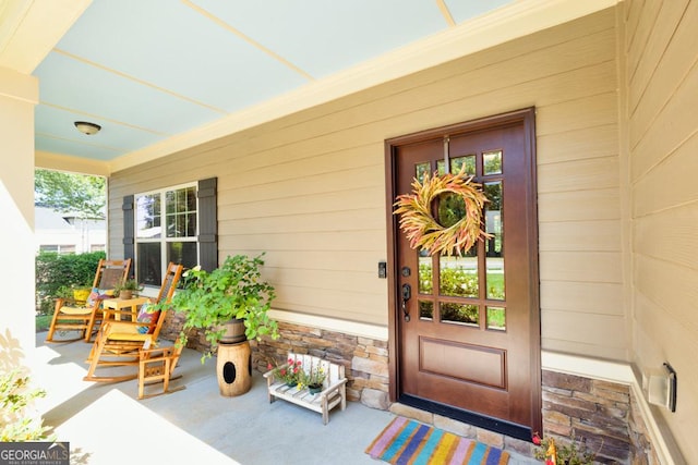 entrance to property with a porch