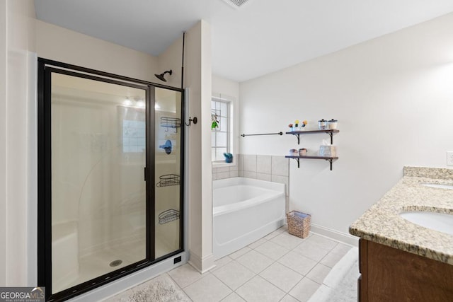 bathroom featuring tile patterned floors, vanity, and plus walk in shower