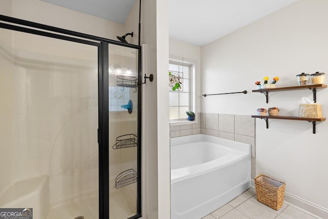 bathroom featuring tile patterned flooring and plus walk in shower