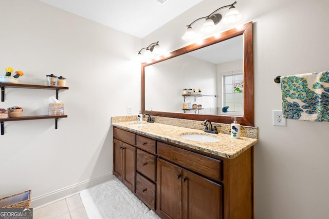 bathroom featuring tile patterned flooring and vanity