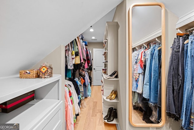 walk in closet featuring light hardwood / wood-style floors