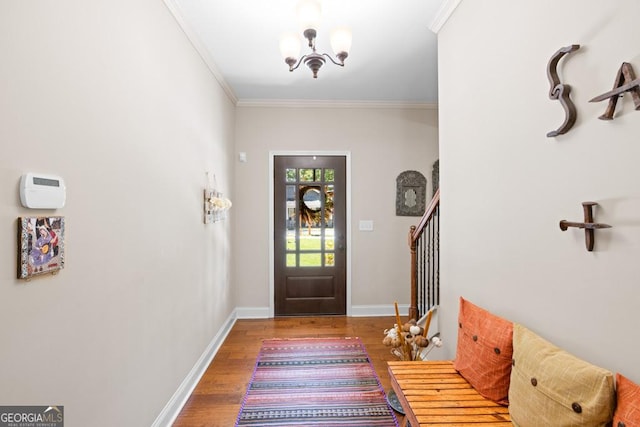 foyer featuring hardwood / wood-style flooring and ornamental molding