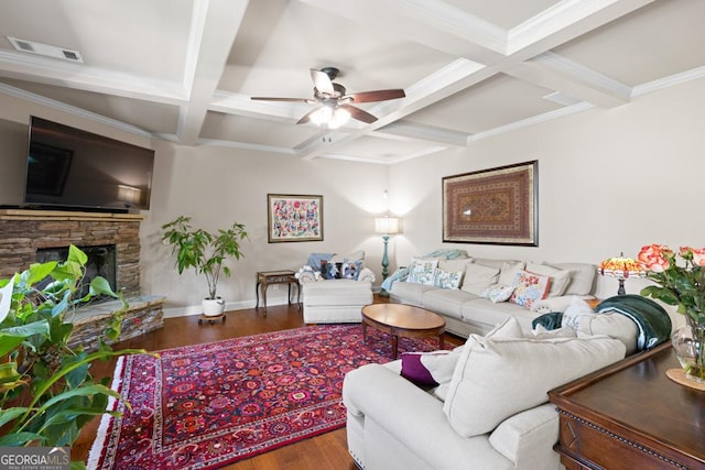 living room featuring coffered ceiling, a stone fireplace, ceiling fan, beamed ceiling, and wood-type flooring