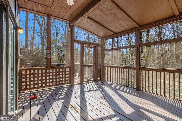 unfurnished sunroom with vaulted ceiling and wood ceiling