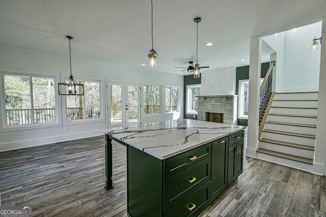 interior space with hardwood / wood-style floors and ceiling fan