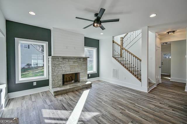 200 Greenpeace Way, Martin, GA 30557 - unfurnished living room with stairway, wood finished floors, ceiling fan, baseboards, and visible vents