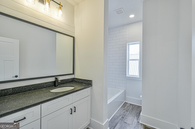 200 Greenpeace Way, Martin, GA 30557 - bathroom with baseboards, wood finished floors, visible vents, and vanity
