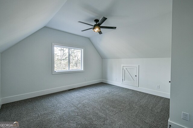 additional living space featuring ceiling fan, carpet floors, and lofted ceiling