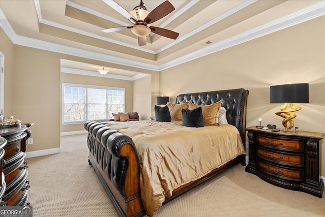 carpeted bedroom featuring ceiling fan, a raised ceiling, and ornamental molding