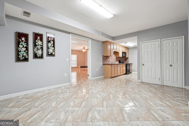 kitchen with tasteful backsplash, ceiling fan, light brown cabinets, and black appliances