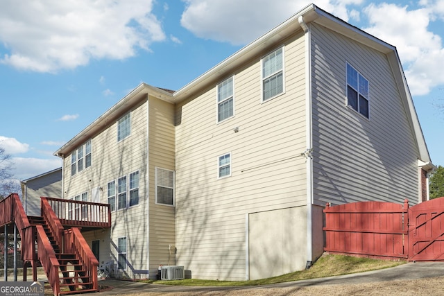 back of house with a wooden deck