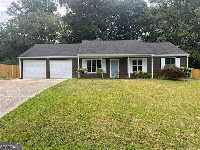 ranch-style home with a front yard and a garage