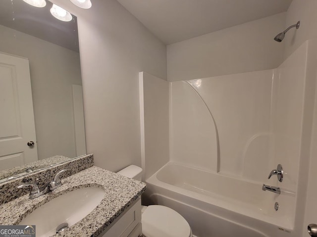 full bathroom featuring bathtub / shower combination, vanity, and toilet