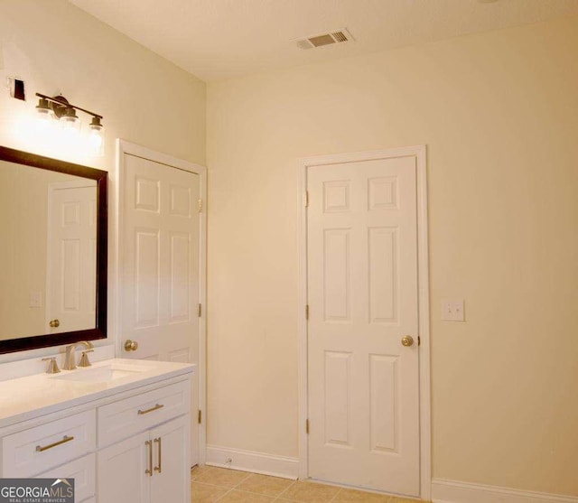 bathroom featuring tile patterned floors and vanity