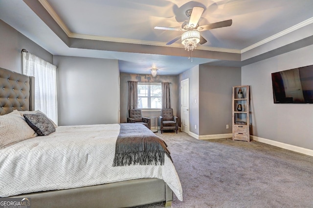 carpeted bedroom featuring a raised ceiling, crown molding, baseboards, and ceiling fan