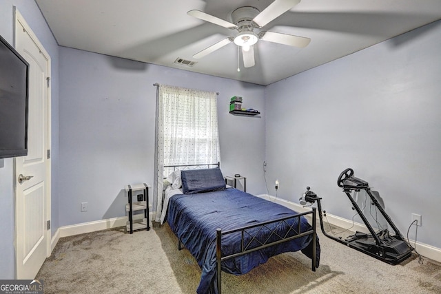 carpeted bedroom featuring ceiling fan and baseboards