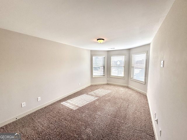 unfurnished room with carpet