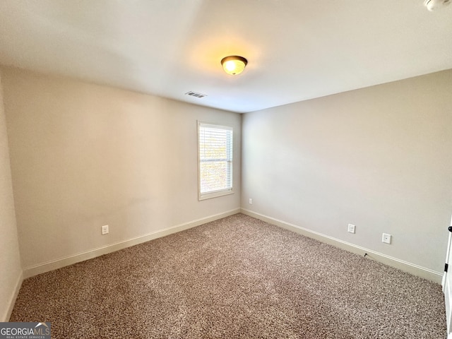 unfurnished room with carpet flooring