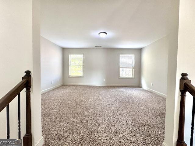 spare room featuring carpet