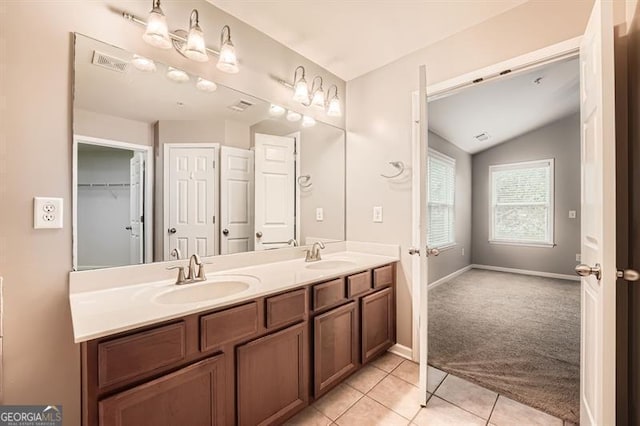 bathroom with tile patterned floors, vanity, and plus walk in shower