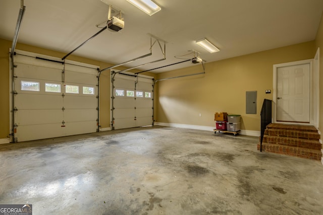 garage with electric panel and a garage door opener