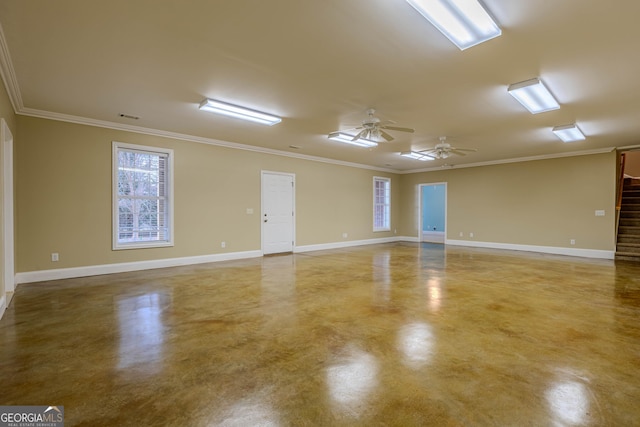 unfurnished room featuring ceiling fan, concrete flooring, and crown molding