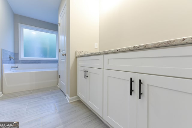 bathroom with a tub