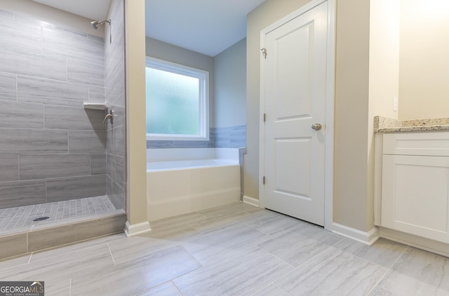 bathroom featuring tile patterned flooring, vanity, and independent shower and bath