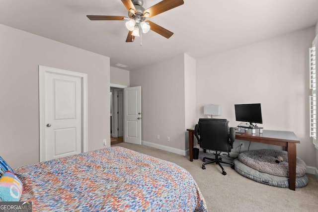 bedroom featuring ceiling fan and light carpet