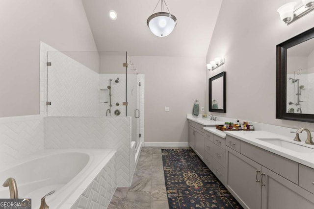 bathroom featuring shower with separate bathtub, vanity, and vaulted ceiling