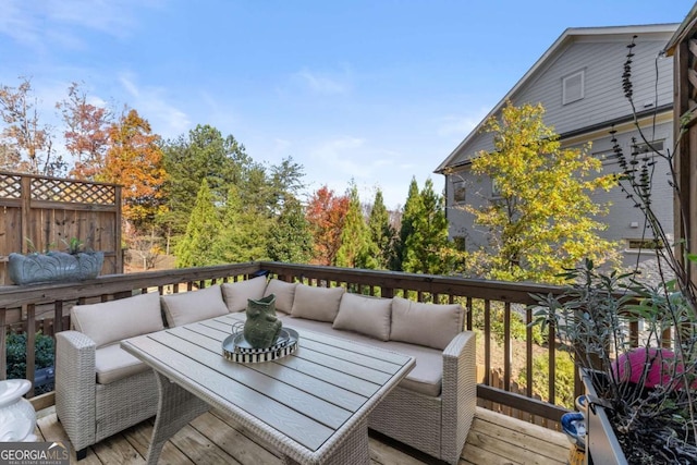 wooden terrace with an outdoor hangout area