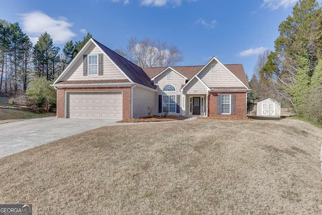 view of front of property with a garage and a storage shed