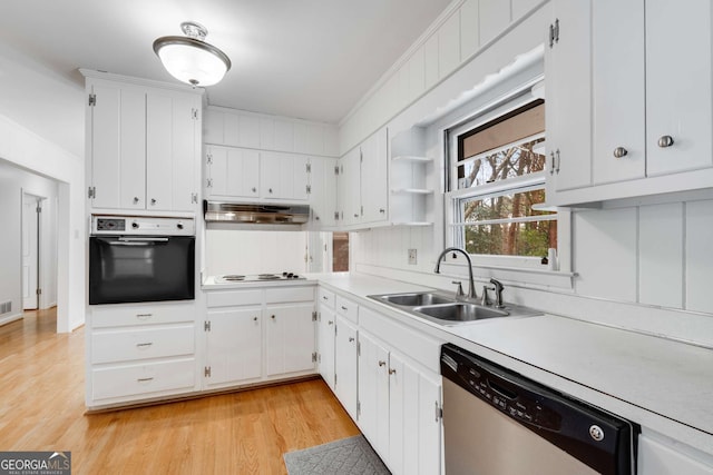 kitchen featuring light wood-type flooring, sink, oven, dishwasher, and white cabinetry