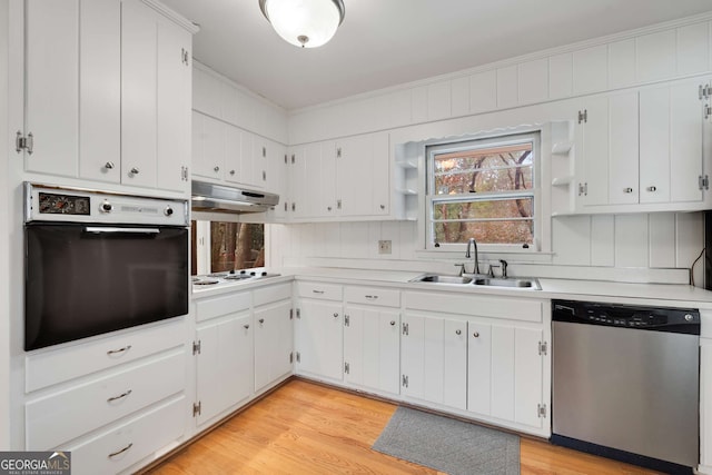 kitchen featuring stainless steel dishwasher, black oven, white cabinets, and sink