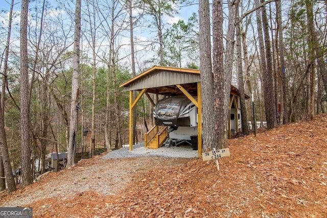 view of outbuilding featuring a carport