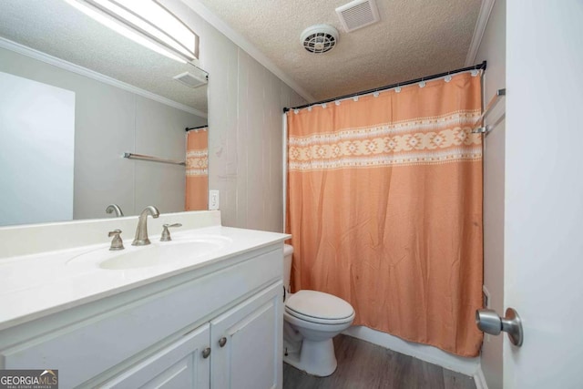 bathroom with vanity, crown molding, a textured ceiling, walk in shower, and wood-type flooring