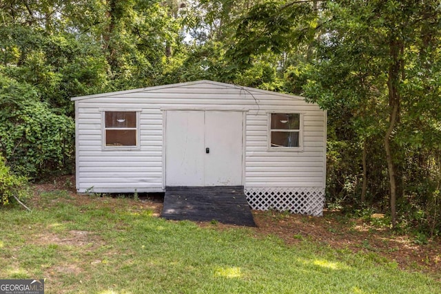 view of outdoor structure with a lawn