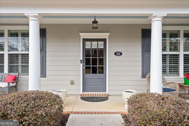 property entrance featuring a porch