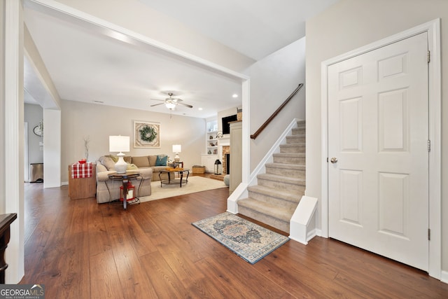 interior space with dark hardwood / wood-style floors and ceiling fan