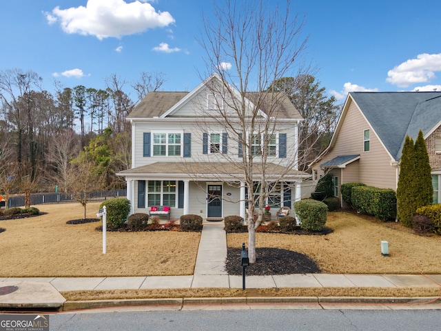 front facade featuring a front yard and a porch