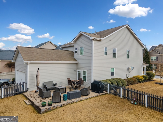 rear view of property with a lawn, a patio area, and an outdoor hangout area