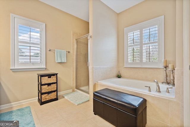 bathroom featuring tile patterned floors, a healthy amount of sunlight, and independent shower and bath