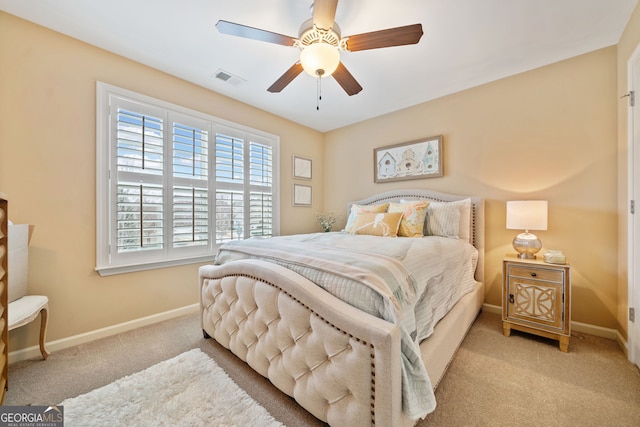 bedroom with light colored carpet and ceiling fan