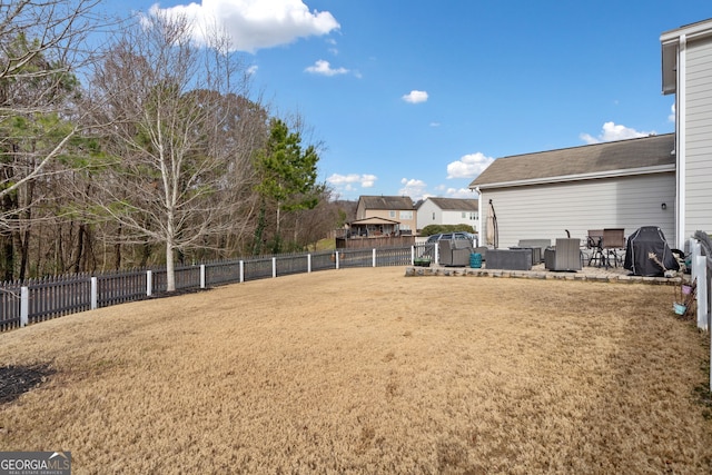 view of yard featuring central air condition unit