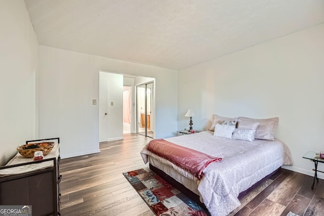 bedroom featuring dark wood-type flooring